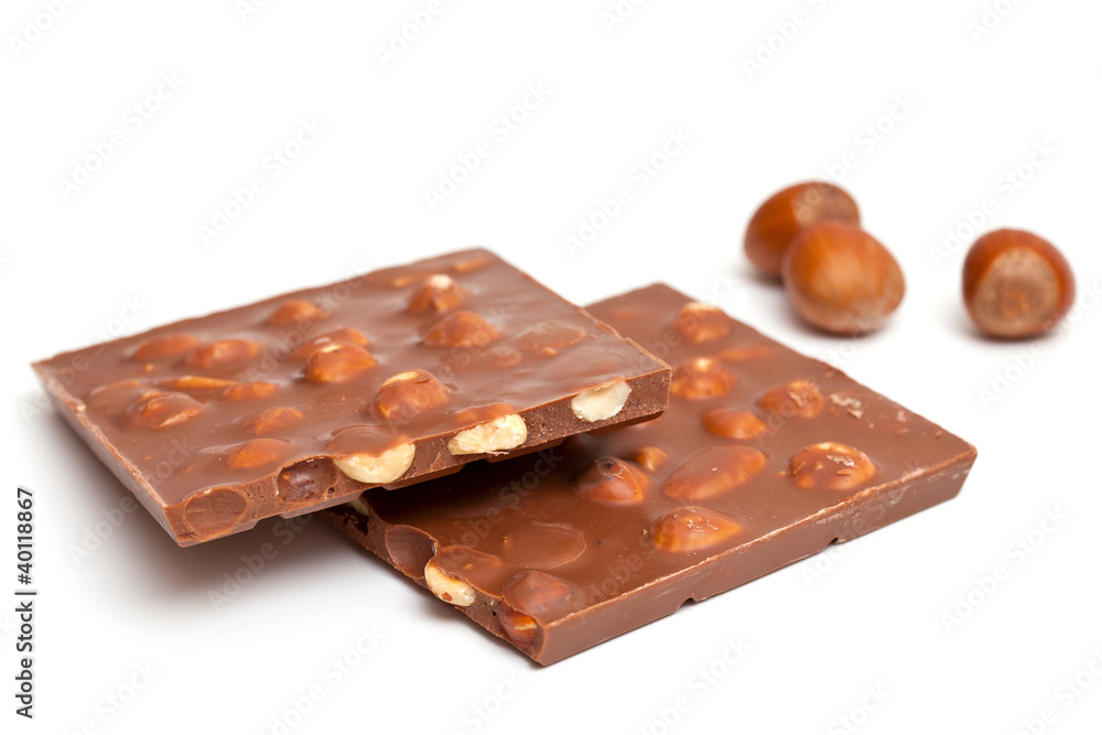milk chocolate with hazelnuts isolated on white milk chocolate with hazelnuts isolated on white