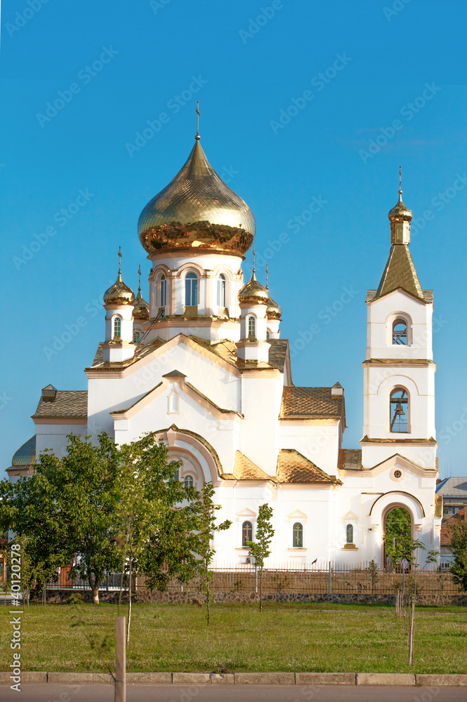 White church with gold domes