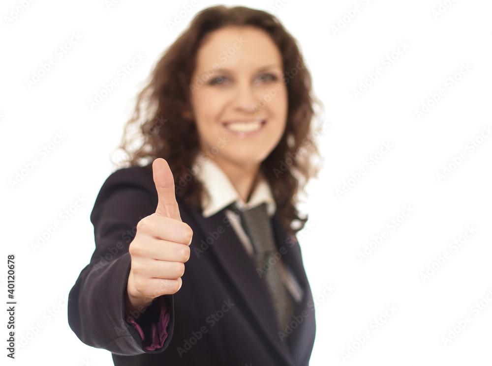 A businesswoman with a thumb up sign, focus on hand A businesswoman with a thumb up sign, focus on hand