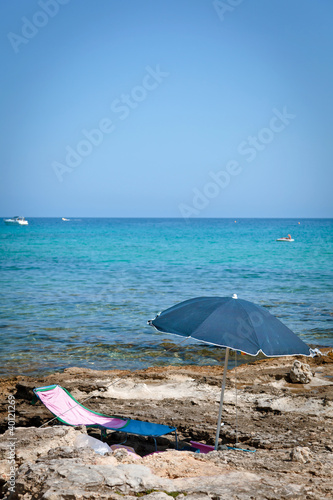 sun umbrella in front of the sea