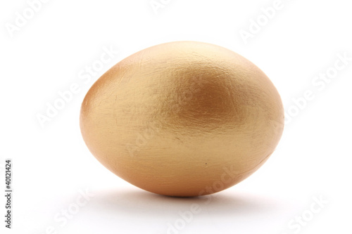 A golden egg isolated on white background