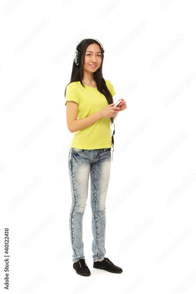A college girl with an earphone, full length, isolated on white A college girl with an earphone, full length, isolated on white