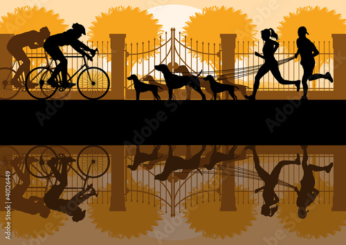 People walking, running and cycling in old vintage city park
