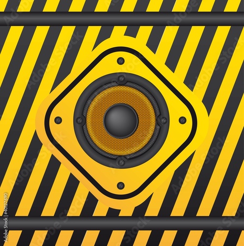 speaker over yellow sign