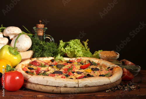 delicious pizza, vegetables and spices
