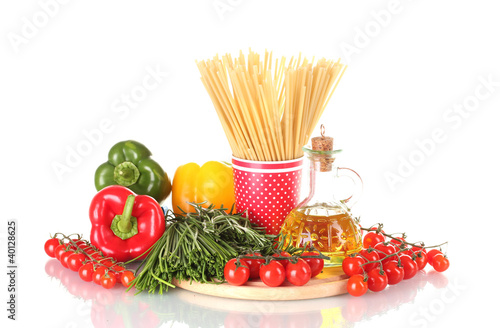 spaghetti in cup, rosemary in mortar, jar of oil and vegetables