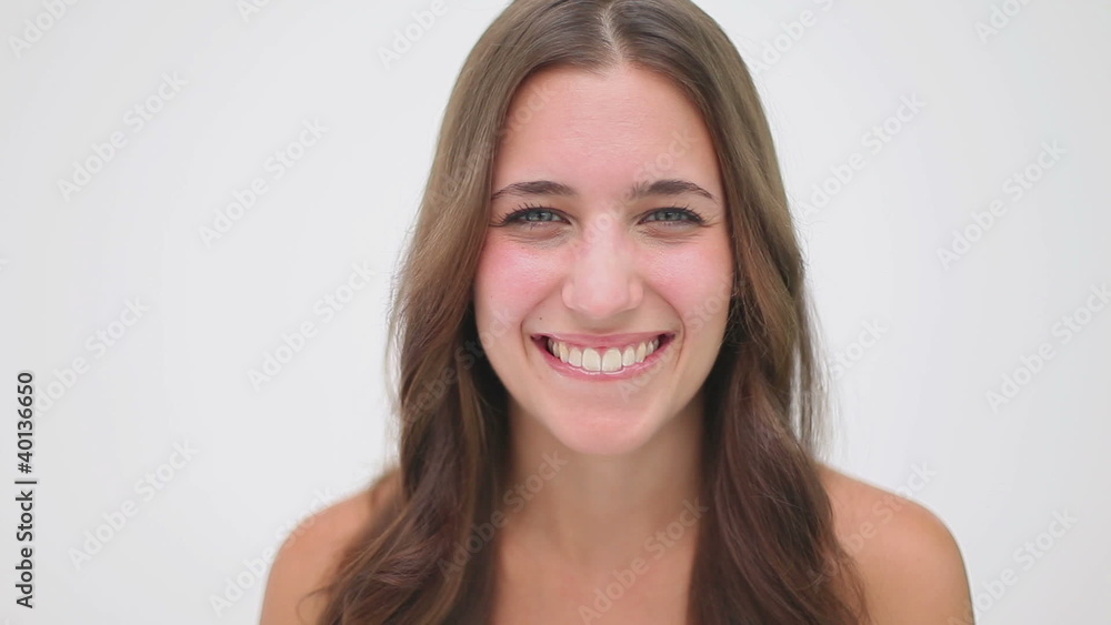 Smiling woman blinking her eyes