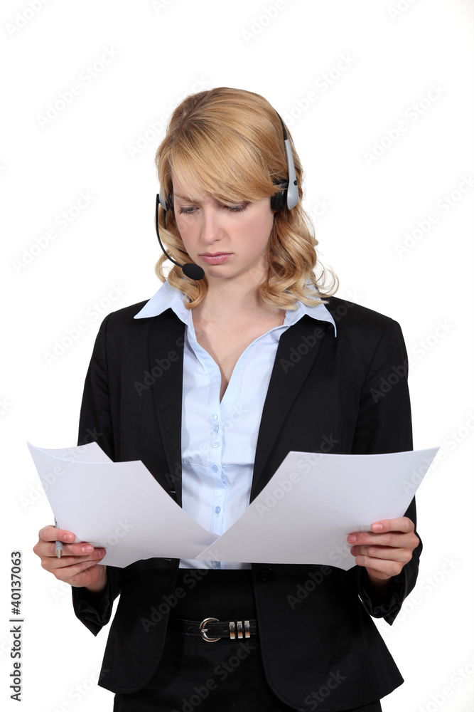 Businesswoman looking at paperwork