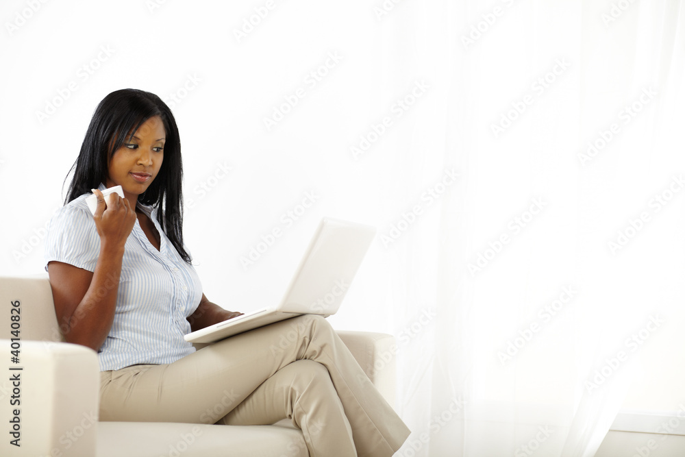 Mistrusted young woman working on laptop Mistrusted young woman working on laptop