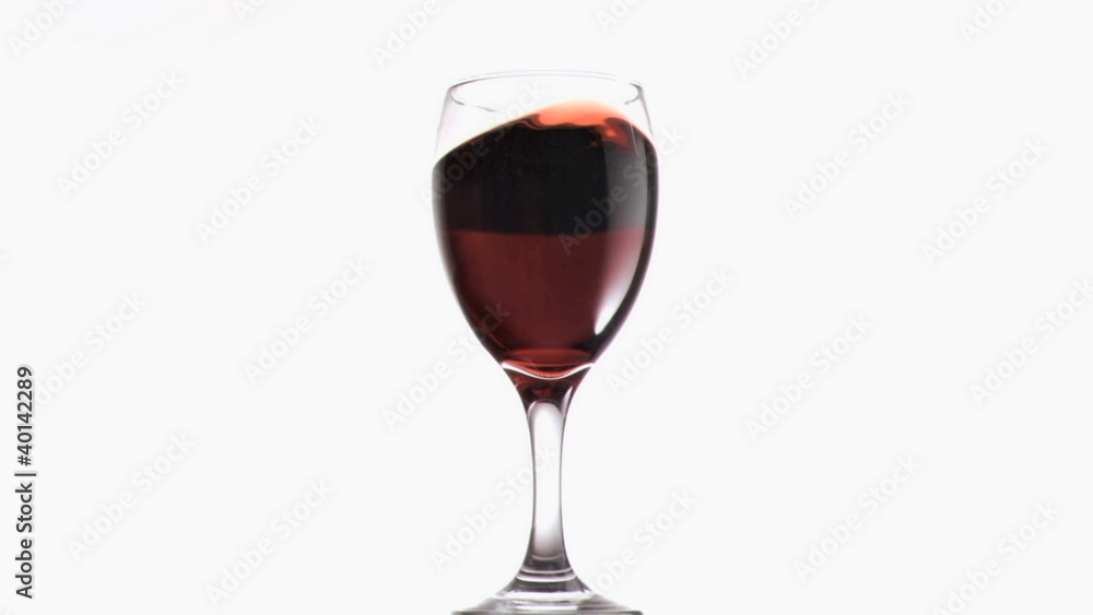 Red wine in rotation in super slow motion Red wine in rotation in super slow motion