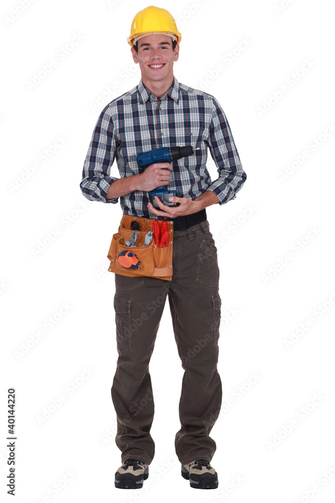 Worker with a cordless drill Worker with a cordless drill