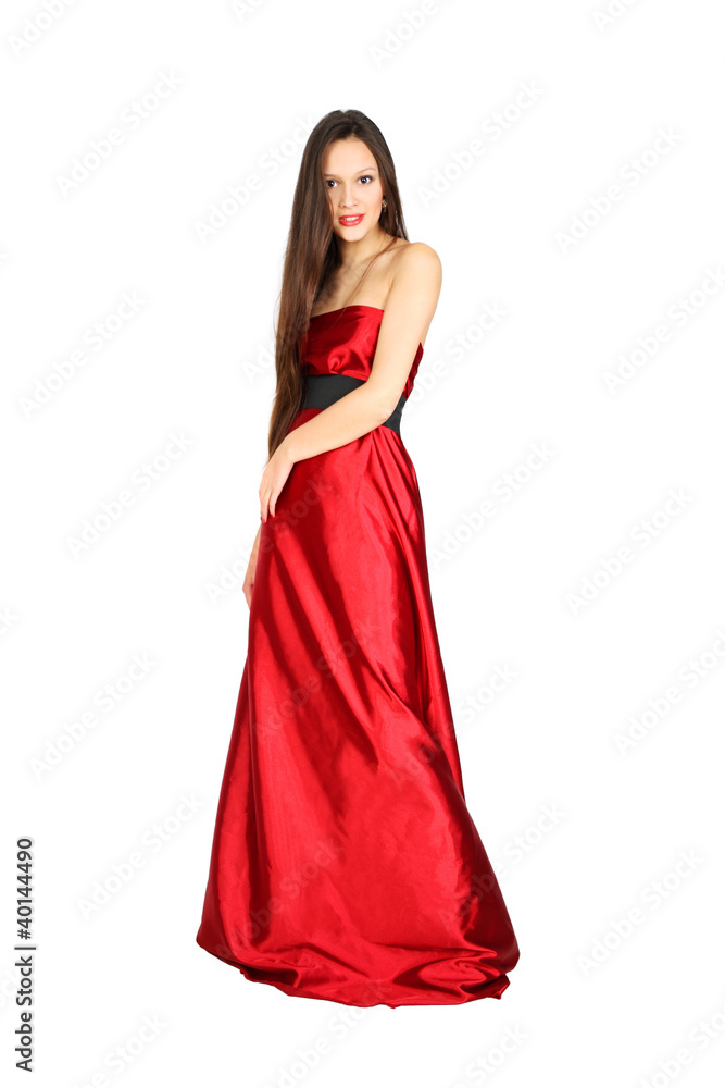 beautiful girl wearing long red dress stands isolated on white b
