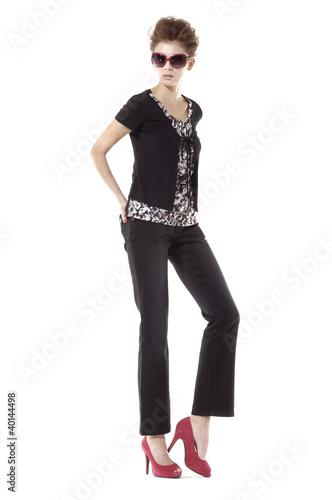 Full body fashion woman wearing sunglasses shot in studio