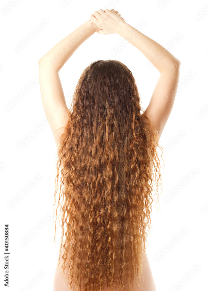 Naklejka premium Young woman with the back and long curly hair