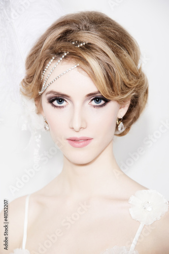 Portrait of young beautiful bride over white background