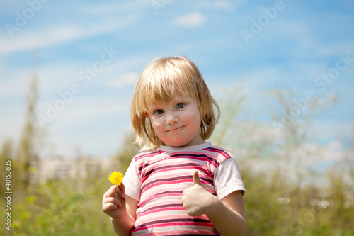 child outdoors in spring