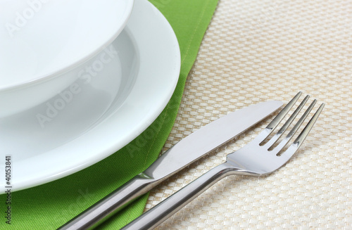 Table setting with fork  knife  plates  and napkin