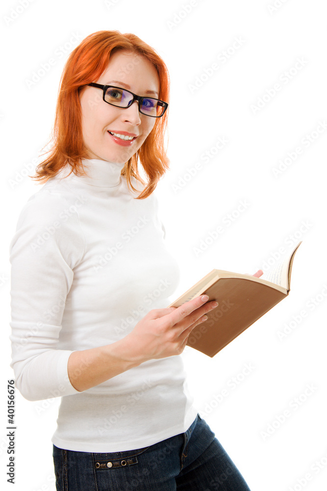 Beautiful red-haired girl in glasses reads book. Beautiful red-haired girl in glasses reads book.