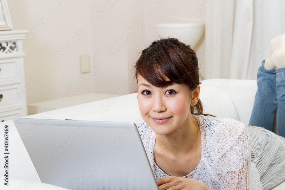 Beautiful asian woman using a laptop computer Beautiful asian woman using a laptop computer