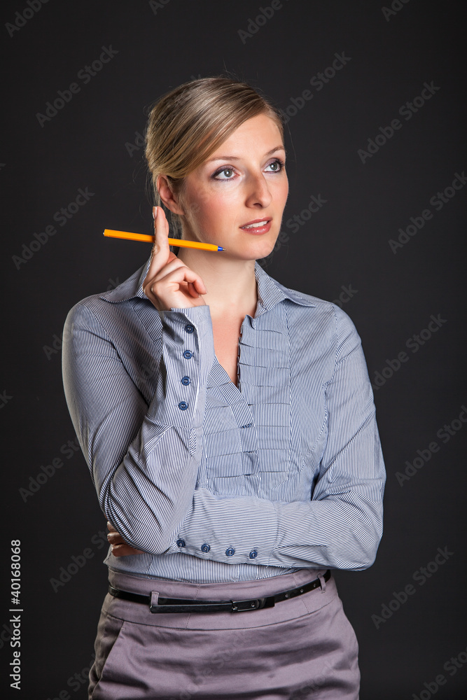 Businesswoman has ideas on gray background Businesswoman has ideas on gray background