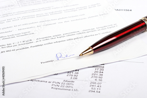 pen and business contract with signature