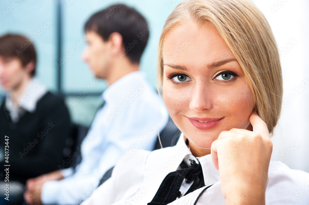 Portrait of a cute business woman with colleagues Portrait of a cute business woman with colleagues