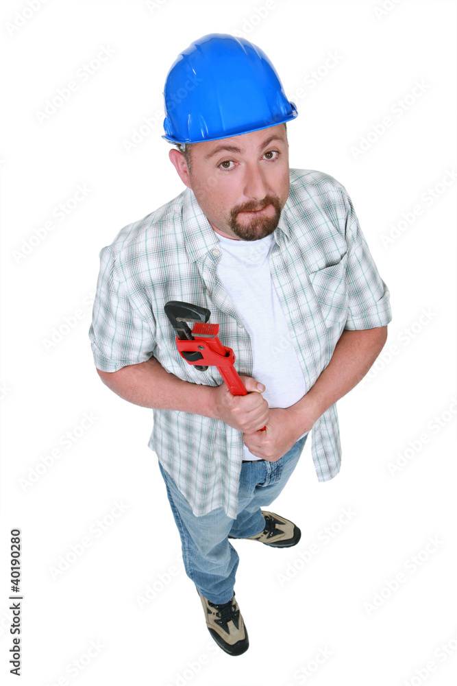 Plumber holding adjustable wrench