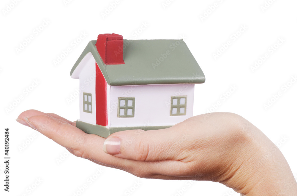 The model house in female hands on white The model house in female hands on white