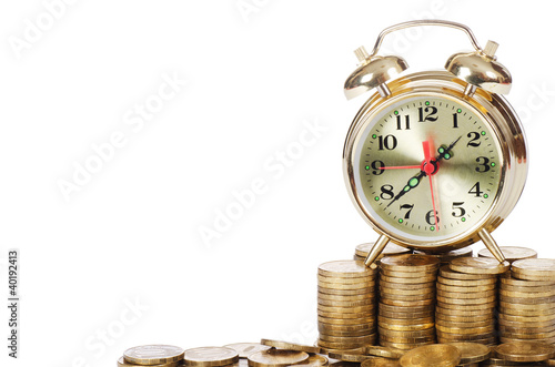 Alarm clock and money isolated on white background