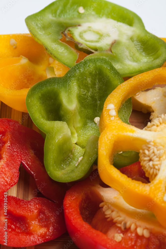 close up of red, yellow and green peppers close up of red, yellow and green peppers