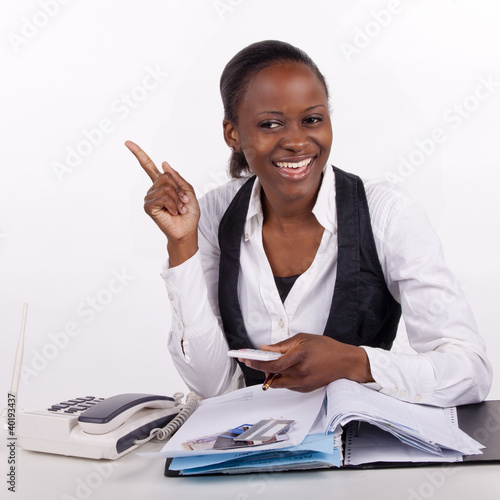 Young woman finding a solution for her budget. photo