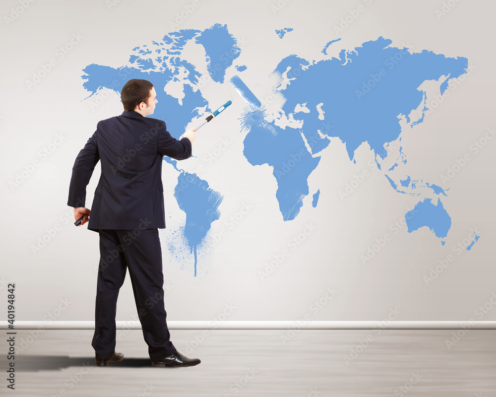 Businessman with paint brush and world map Businessman with paint brush and world map