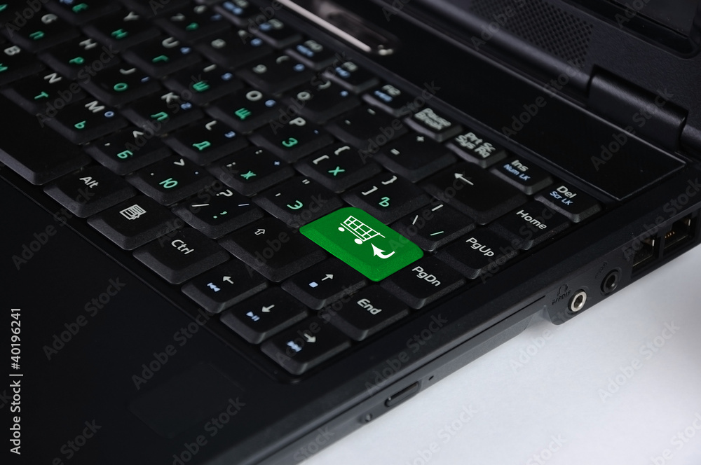 Computer keyboard with on-line shopping symbol Computer keyboard with on-line shopping symbol