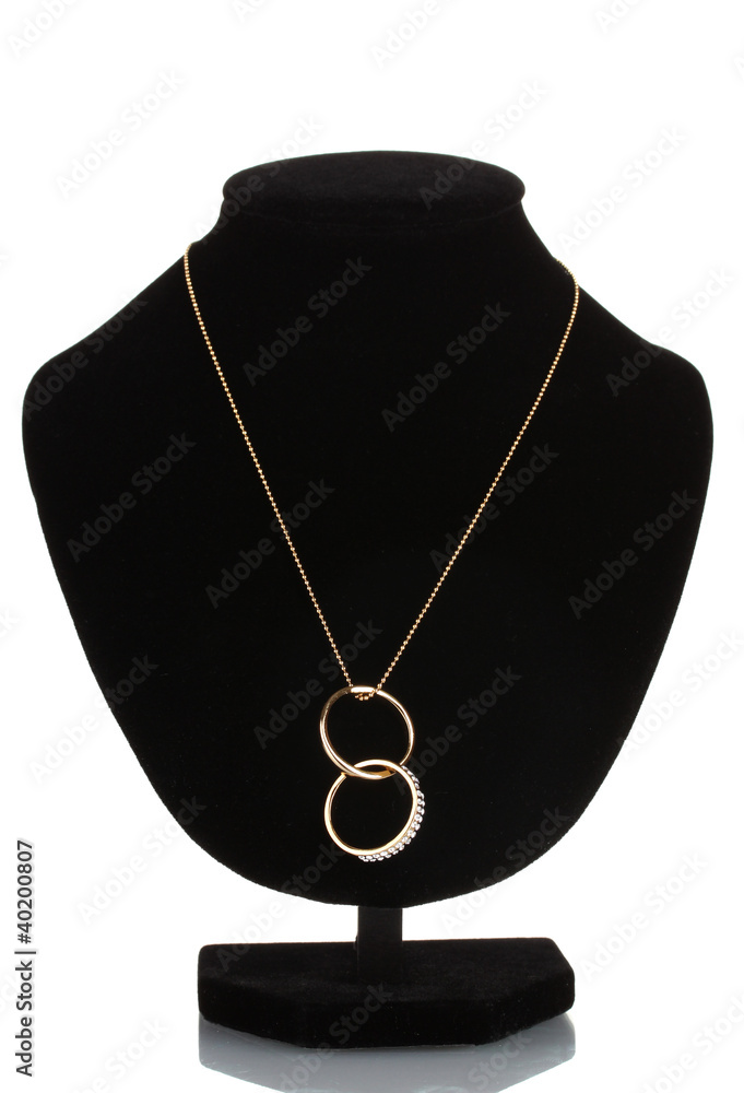 Pendant in form of rings with gem on mannequin isolated on white Pendant in form of rings with gem on mannequin isolated on white