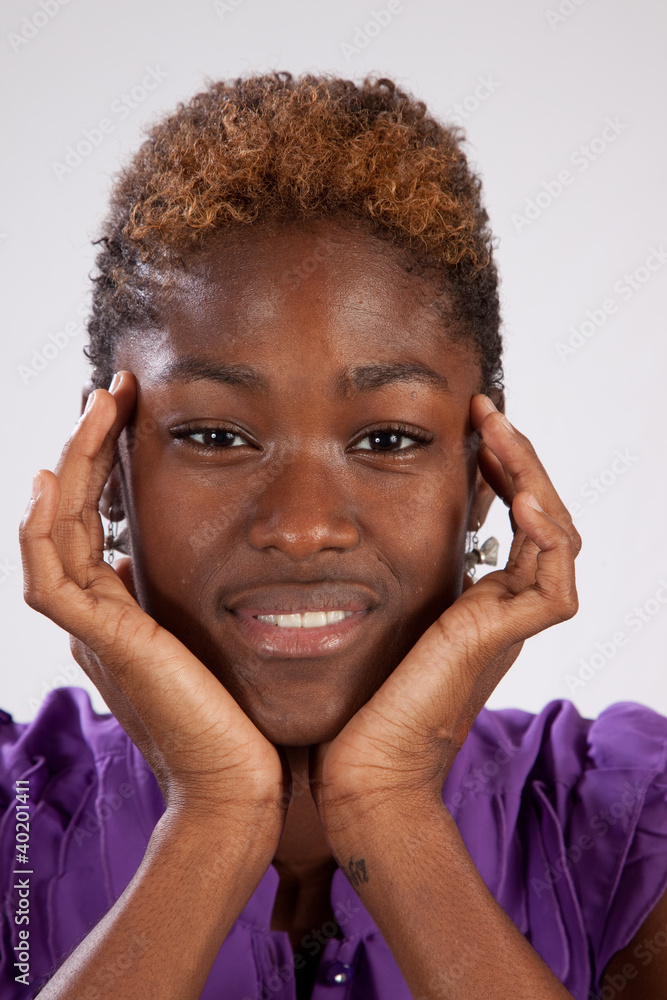 Lovely black woman with chin in her hands Lovely black woman with chin in her hands