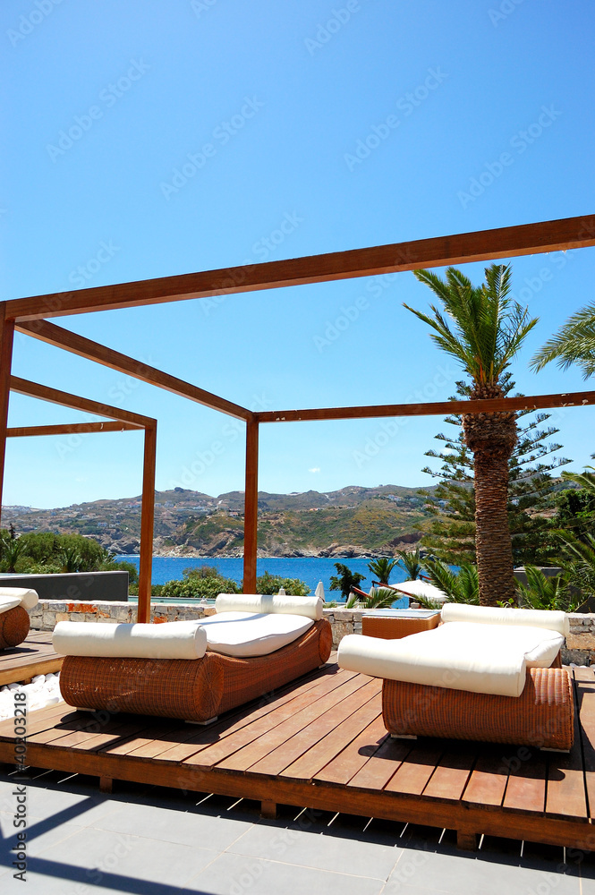 Modern hut and sunbeds at luxury hotel, Crete, Greece Modern hut and sunbeds at luxury hotel, Crete, Greece