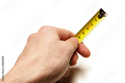 Tape-measure in hand isolated on white background