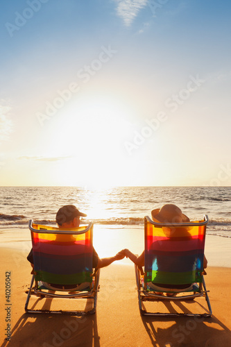 Happy Romantic Couple Enjoying Beautiful Sunset at the Beach