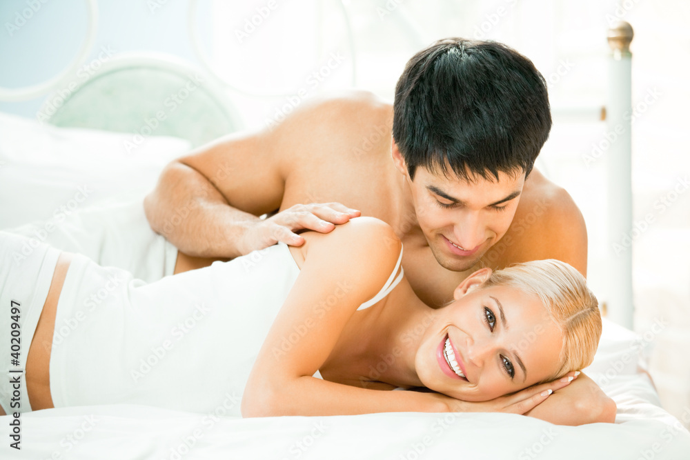 Couple making love in bed Couple making love in bed