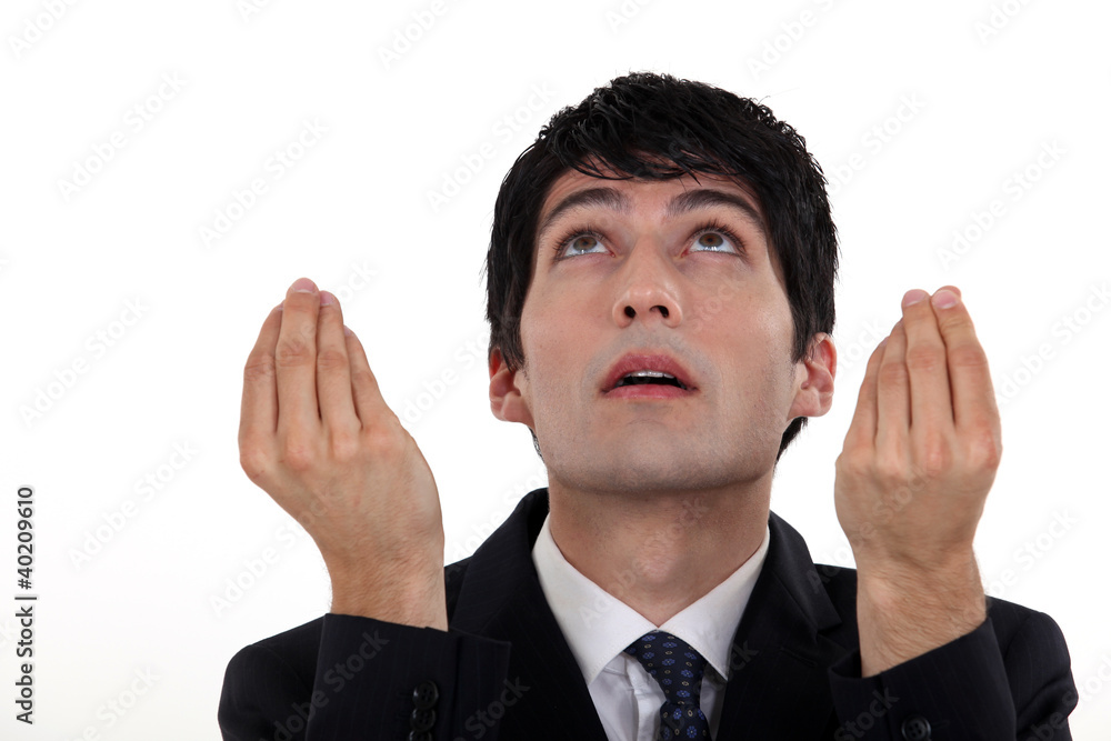 A businessman looking up.