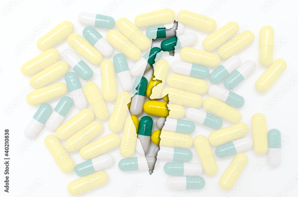 Outline map of israel with pills in the background for health an Outline map of israel with pills in the background for health an