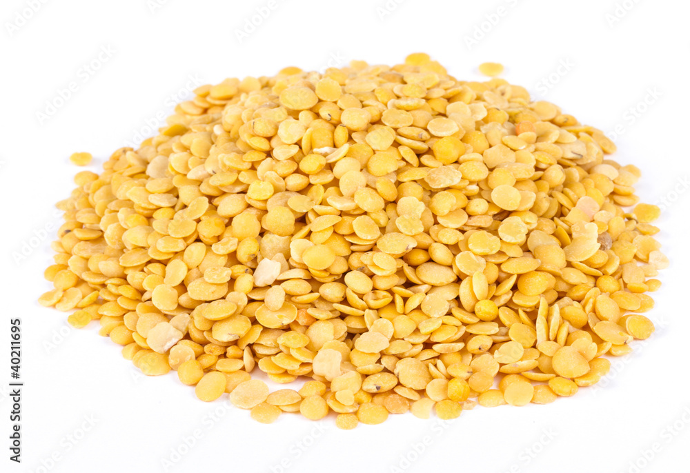 Yellow lentils isolated on white background.Macro shot Yellow lentils isolated on white background.Macro shot