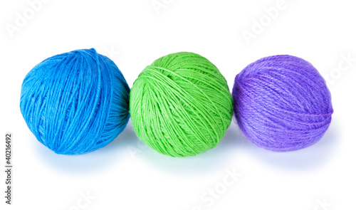 three colored woolen balls