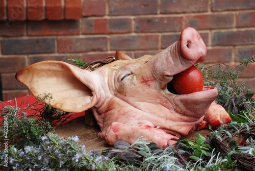 Pigs head stuffed with a red apple
