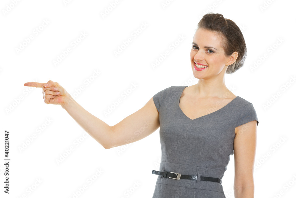 Modern business woman pointing in corner Modern business woman pointing in corner