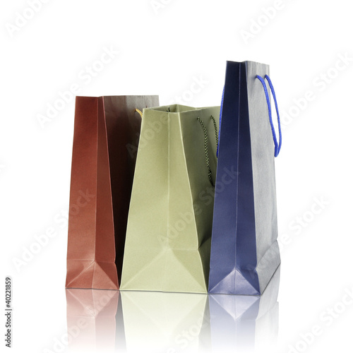 Colorful shopping bags on reflect floor and white background