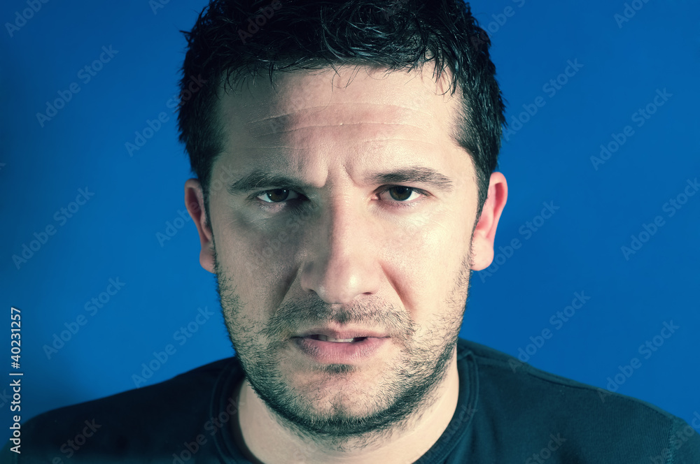 Fototapeta premium Close up portrait of real man. Undefined face expression