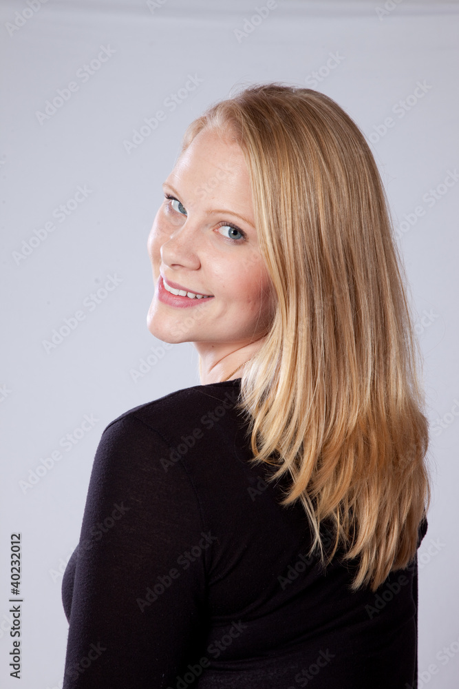 Blond woman smiling at the camera Blond woman smiling at the camera