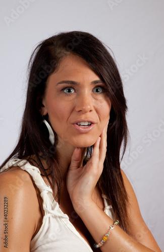 woman looking thoughtfully at the camera