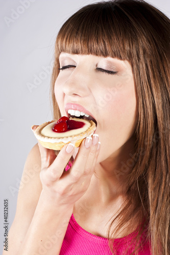 Young beautiful woman with a cake